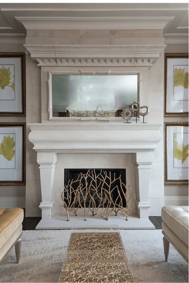 A living room with a fireplace and a mirror